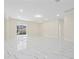 Spacious living area with marble floors and access to backyard at 2828 Sequoyah Dr, Haines City, FL 33844