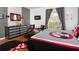 Bright bedroom with king-size bed, dresser, and Mickey Mouse decor at 453 Water St, Kissimmee, FL 34747