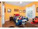 Mickey Mouse themed bedroom with wood floors and a built-in workspace at 453 Water St, Kissimmee, FL 34747