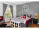 Main bedroom with Mickey Mouse bedding and a large window at 453 Water St, Kissimmee, FL 34747