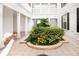 Central courtyard with lush tropical plants and a tiled floor at 453 Water St, Kissimmee, FL 34747