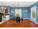 Charming dining area with hardwood floors and a round table for four at 453 Water St, Kissimmee, FL 34747