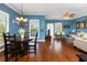 Bright dining area with hardwood floors and a round table for four at 453 Water St, Kissimmee, FL 34747