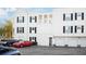 White building with parking and a red car in front at 453 Water St, Kissimmee, FL 34747