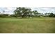 Landscaped golf course with a putting green at 453 Water St, Kissimmee, FL 34747