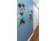 Hallway with Mickey and Minnie Mouse wall art at 453 Water St, Kissimmee, FL 34747