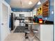 Bright kitchen with stainless steel appliances and Mickey Mouse decor at 453 Water St, Kissimmee, FL 34747