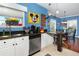 Modern kitchen with stainless steel appliances and a breakfast bar at 453 Water St, Kissimmee, FL 34747