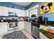 Well-equipped kitchen featuring stainless steel appliances and stylish decor at 453 Water St, Kissimmee, FL 34747