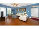 Living room features hardwood floors, a Mickey Mouse theme, and comfortable seating at 453 Water St, Kissimmee, FL 34747