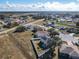 Aerial view of house, neighborhood, and surrounding landscape at 513 Big Black Way, Kissimmee, FL 34759