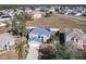 Aerial view of house with solar panels and driveway at 513 Big Black Way, Kissimmee, FL 34759