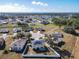 Aerial view of a neighborhood with a house featuring solar panels at 513 Big Black Way, Kissimmee, FL 34759