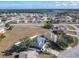 Aerial view of house, neighborhood, and surrounding landscape at 513 Big Black Way, Kissimmee, FL 34759