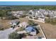 Aerial view of house, neighborhood, and surrounding landscape at 513 Big Black Way, Kissimmee, FL 34759
