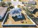Aerial view showcasing home's backyard, solar panels and white fence at 513 Big Black Way, Kissimmee, FL 34759