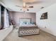 Elegant bedroom with upholstered bed and window seat at 513 Big Black Way, Kissimmee, FL 34759