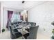Elegant dining room with a glass table and crystal chandelier at 513 Big Black Way, Kissimmee, FL 34759