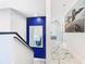 Elegant hallway with marble floors and a blue accent wall at 513 Big Black Way, Kissimmee, FL 34759