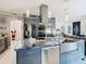 Modern kitchen with stainless steel appliances and large island at 513 Big Black Way, Kissimmee, FL 34759