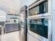 Modern kitchen with built-in wall oven and microwave at 513 Big Black Way, Kissimmee, FL 34759