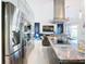 Modern kitchen with stainless steel appliances and marble countertops at 513 Big Black Way, Kissimmee, FL 34759