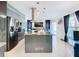Open concept kitchen featuring a large island and stainless steel appliances at 513 Big Black Way, Kissimmee, FL 34759