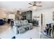 Open living room with a gray sectional sofa and kitchen views at 513 Big Black Way, Kissimmee, FL 34759