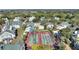 Aerial view of community with tennis courts and pools at 5980 Westgate Dr # Apt 103, Orlando, FL 32835