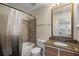 Clean bathroom with shower/tub combo, granite countertop, and updated vanity at 5980 Westgate Dr # Apt 103, Orlando, FL 32835