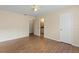 Bedroom with wood flooring, ceiling fan, and access to bathroom at 5980 Westgate Dr # Apt 103, Orlando, FL 32835