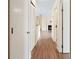 Bright hallway with wood flooring, leading to other rooms at 5980 Westgate Dr # Apt 103, Orlando, FL 32835