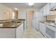 Kitchen with granite countertops, white cabinets, and appliances at 5980 Westgate Dr # Apt 103, Orlando, FL 32835
