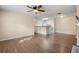 Open living room with hardwood floors and kitchen view at 5980 Westgate Dr # Apt 103, Orlando, FL 32835