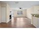 Spacious living room with fireplace and wood-look flooring at 5980 Westgate Dr # Apt 103, Orlando, FL 32835