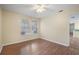 Living room with wood flooring and two windows at 5980 Westgate Dr # Apt 103, Orlando, FL 32835