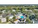 Community pool area with gazebo, landscaping, and tennis court at 5980 Westgate Dr # Apt 103, Orlando, FL 32835