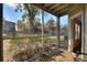 Relaxing screened porch overlooking a tree and yard at 5980 Westgate Dr # Apt 103, Orlando, FL 32835
