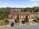 Aerial view of townhomes with tile roofs and a community setting at 8121 Roseville Blvd, Davenport, FL 33896