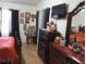 Bedroom with a dresser, TV, and window coverings at 10407 Sw 85Th Ct, Ocala, FL 34481