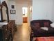 Bedroom with an ensuite bathroom and a couch at 10407 Sw 85Th Ct, Ocala, FL 34481