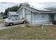 House exterior with a two-car garage and solar panels at 10407 Sw 85Th Ct, Ocala, FL 34481