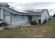 House exterior with solar panels, garage, and landscaping at 10407 Sw 85Th Ct, Ocala, FL 34481