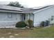 House exterior showcasing solar panels and landscaping at 10407 Sw 85Th Ct, Ocala, FL 34481