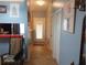 Home hallway with light walls and tiled floors at 10407 Sw 85Th Ct, Ocala, FL 34481