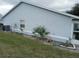 Light gray house with small yard and AC unit at 10407 Sw 85Th Ct, Ocala, FL 34481