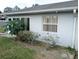Side view of house showcasing a neat and tidy exterior at 10407 Sw 85Th Ct, Ocala, FL 34481