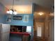 Kitchen with a breakfast bar and view into living area at 10407 Sw 85Th Ct, Ocala, FL 34481