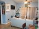 Bright living room with tiled floors and comfy seating at 10407 Sw 85Th Ct, Ocala, FL 34481