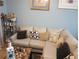 Living room with sectional sofa and decorative pillows at 10407 Sw 85Th Ct, Ocala, FL 34481